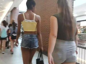 Skinny black girl and white teen at mall Picture 5