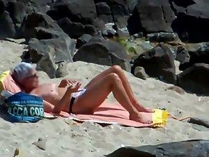 Peeping on a sun tanning woman Picture 7