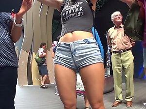 Tall girl isn't aware she shows cameltoe in shorts Picture 3