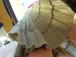 Peeping on her buttocks under a skirt Picture 2