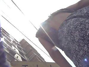 Sexy thong isn't covering her hot pussy in upskirt Picture 6