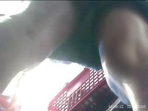 Upskirt view of a chick in groceries store Picture 5