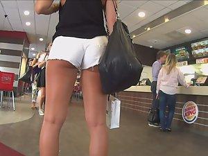 Tall blonde looks sexy in white shorts Picture 3