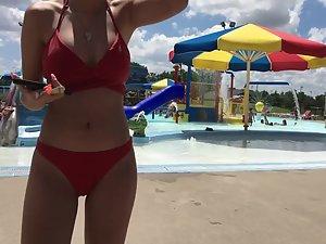 Sexy girl in red two piece bikini at the swimming pool