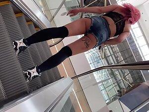 Slutty girl on the shopping mall escalator Picture 1
