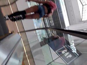 Slutty girl on the shopping mall escalator Picture 2