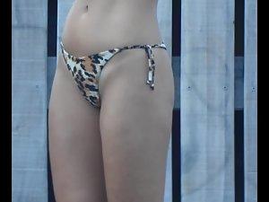Shaved pussy in leopard thong bikini Picture 1