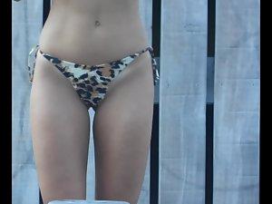 Shaved pussy in leopard thong bikini Picture 2