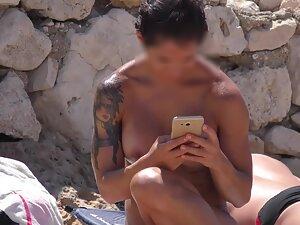 Examining a sexy muscular girlfriend of some guy on the beach Picture 4