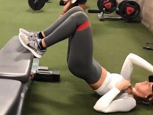 Fit girl does a sexually suggestive exercise in the gym