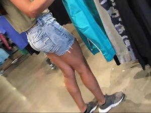 Voyeur follows a sporty girl into the sports store Picture 2