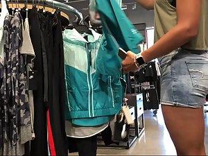 Voyeur follows a sporty girl into the sports store Picture 3