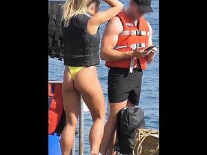 Epic blonde in yellow bikini caught on beach Picture 7