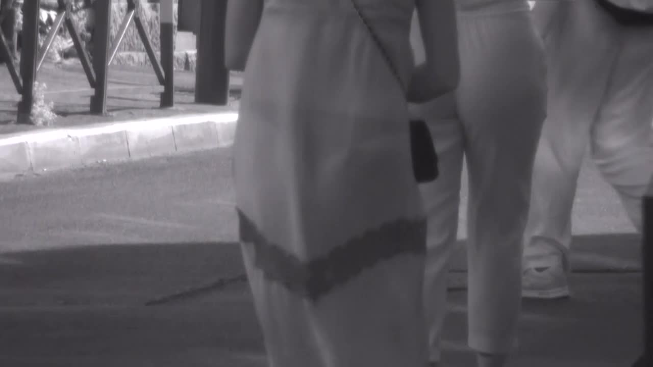 Thong and butt tattoo seen through dress image