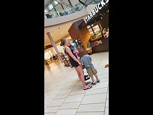 Young milf in tight shorts at the shopping mall Picture 3