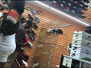 Black girl's hard nipples are visible in shoe store Picture 1