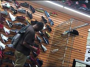 Black girl's hard nipples are visible in shoe store Picture 2