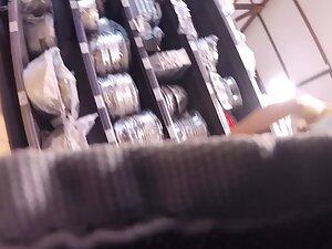 Voyeur caught her upskirt when she bent over Picture 1