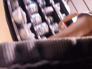 Voyeur caught her upskirt when she bent over Picture 3