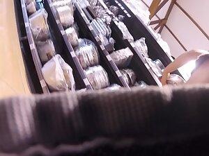 Voyeur caught her upskirt when she bent over Picture 4