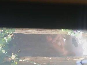 Mature woman spied during a shower Picture 2