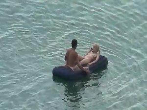 Nude people floating on air mattresses Picture 2