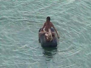 Nude people floating on air mattresses Picture 3