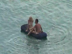 Nude people floating on air mattresses Picture 4