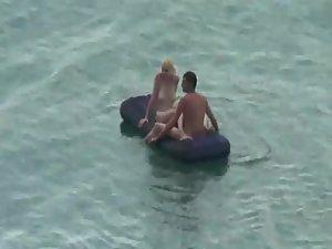 Nude people floating on air mattresses Picture 5