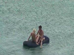 Nude people floating on air mattresses Picture 7