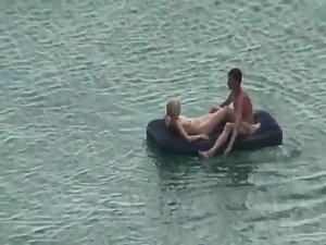 Nude people floating on air mattresses Picture 8