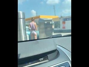 Sexy kind of a masculine girl at a gas station Picture 1