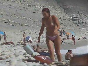 Topless babe gets out of the water Picture 2