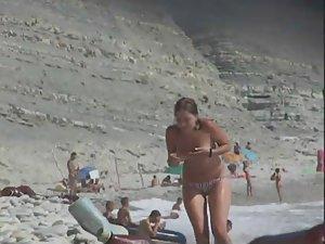 Topless babe gets out of the water Picture 6