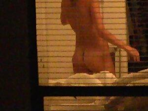 Quick peep on naked neighbor through her window Picture 1