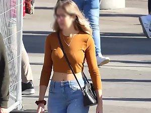 Strap of her purse emphasizes her big boobs Picture 7
