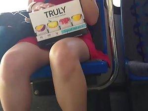 Pretty girl in red dress on bus station and in the bus Picture 4
