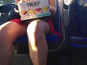 Pretty girl in red dress on bus station and in the bus Picture 5