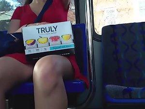 Pretty girl in red dress on bus station and in the bus Picture 7