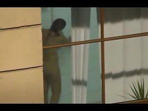 Naked girl standing by the window Picture 6