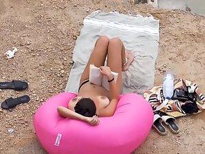 Big topless boobs of beach girl reading a book Picture 4