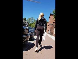 Thong and buttocks of fit milf in black leggings Picture 2