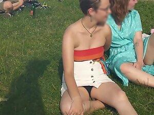 Upskirt of cute lesbian tomboy sitting on the grass Picture 2