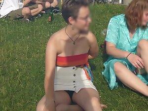 Upskirt of cute lesbian tomboy sitting on the grass Picture 3