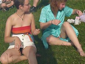 Upskirt of cute lesbian tomboy sitting on the grass Picture 4
