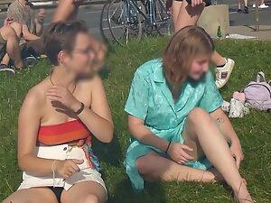 Upskirt of cute lesbian tomboy sitting on the grass Picture 5