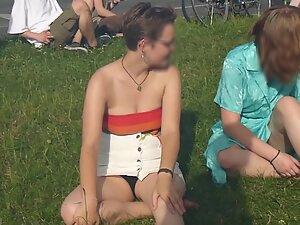 Upskirt of cute lesbian tomboy sitting on the grass Picture 6