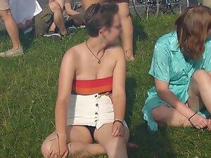 Upskirt of cute lesbian tomboy sitting on the grass Picture 7