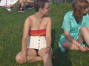Upskirt of cute lesbian tomboy sitting on the grass Picture 8