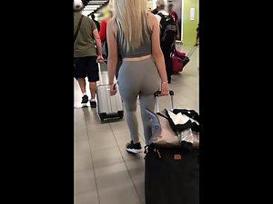 Following blonde's big booty while she pulls luggage Picture 2